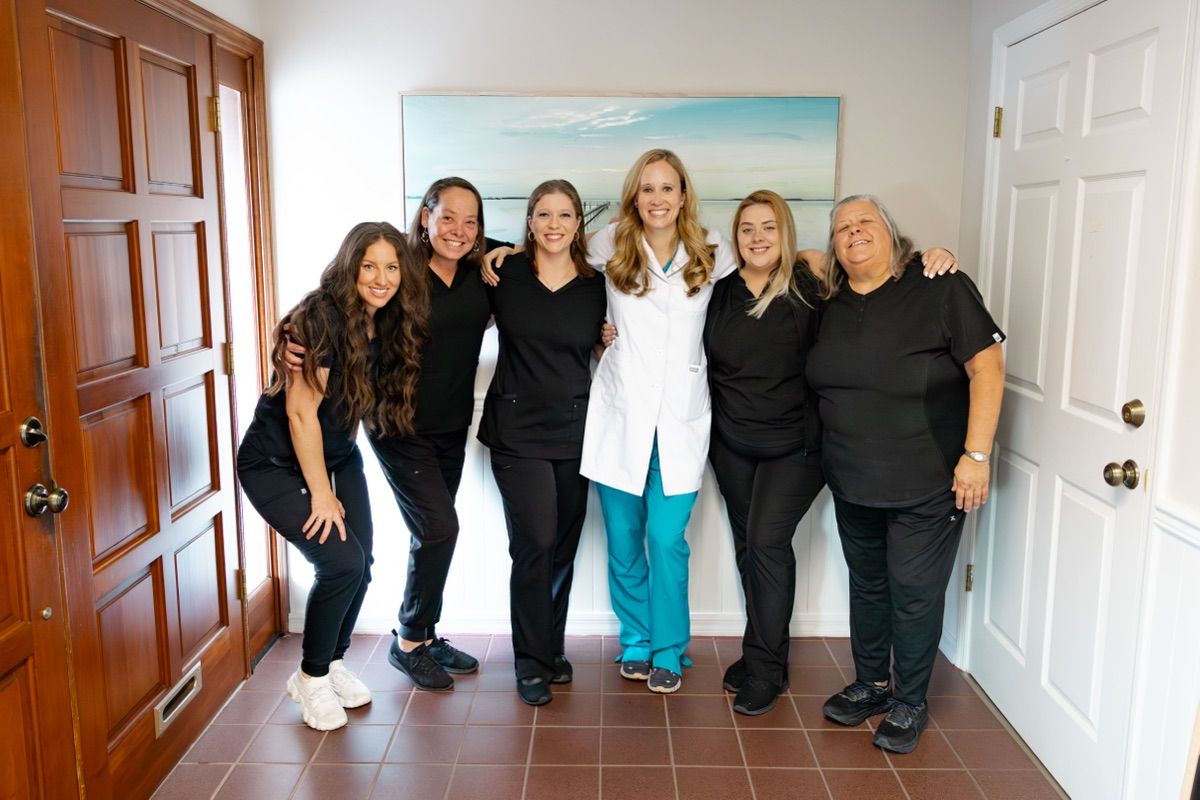 Dr. Pierpont and the Pier Dental team in the office lobby, emergency dentist in Tampa, FL